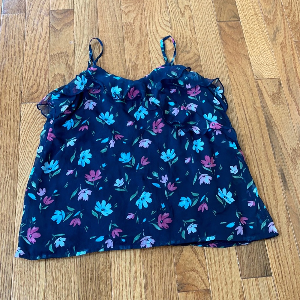 flower shirt w/ details on the bottom & flares